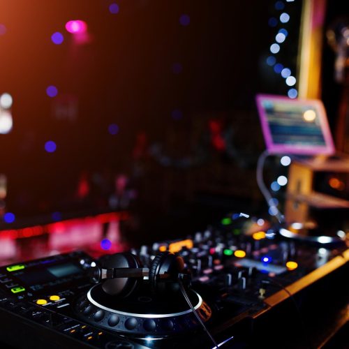dj-spinning-mixing-scratching-track-controls-dj-s-deck-strobe-dj-music-club-life-concept